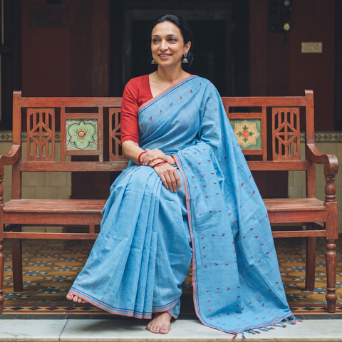 Blue Handloom Cotton Buti Srikakulam Jamdani Saree, draped and worn by a woman, AI visual of the saree, iTokri