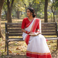 White Handloom Cotton Phulia Jamdani Saree, draped and worn by a woman, AI visual of the saree, iTokri