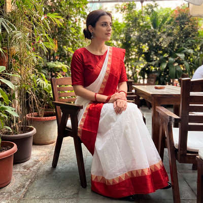 White Handloom Cotton Phulia Jamdani Saree, draped and worn by a woman, AI visual of the saree, iTokri