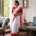 White Handloom Cotton Phulia Jamdani Saree, draped and worn by a woman, AI visual of the saree, iTokri