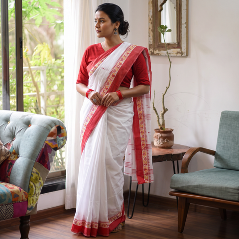 White Handloom Cotton Phulia Jamdani Saree, draped and worn by a woman, AI visual of the saree, iTokri
