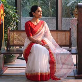 White Handloom Cotton Phulia Jamdani Saree, draped and worn by a woman, AI visual of the saree, iTokri
