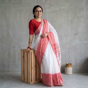 White Handloom Cotton Phulia Jamdani Saree, draped and worn by a woman, AI visual of the saree, iTokri