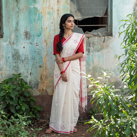 White Handloom Cotton Phulia Jamdani Saree, draped and worn by a woman, AI visual of the saree, iTokri