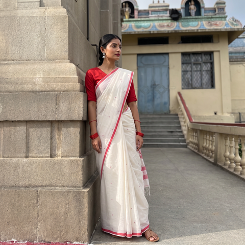 White Handloom Cotton Phulia Jamdani Saree, draped and worn by a woman, AI visual of the saree, iTokri