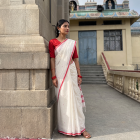 White Handloom Cotton Phulia Jamdani Saree, draped and worn by a woman, AI visual of the saree, iTokri