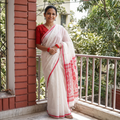 White Handloom Cotton Phulia Jamdani Saree, draped and worn by a woman, AI visual of the saree, iTokri