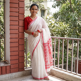 White Handloom Cotton Phulia Jamdani Saree, draped and worn by a woman, AI visual of the saree, iTokri