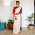 White Handloom Cotton Phulia Jamdani Saree, draped and worn by a woman, AI visual of the saree, iTokri