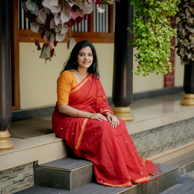 Red Handloom Cotton Phulia Jamdani Saree, draped and worn by a woman, AI visual of the saree, iTokri