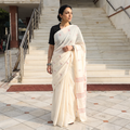White Handloom Cotton Phulia Jamdani Saree, draped and worn by a woman, AI visual of the saree, iTokri