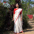 White Handloom Cotton Phulia Jamdani Saree, draped and worn by a woman, AI visual of the saree, iTokri