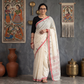 White Handloom Cotton Phulia Jamdani Saree, draped and worn by a woman, AI visual of the saree, iTokri