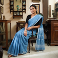 Blue Handloom Cotton Phulia Jamdani Saree with Tassels, draped and worn by a woman, AI visual of the saree, iTokri