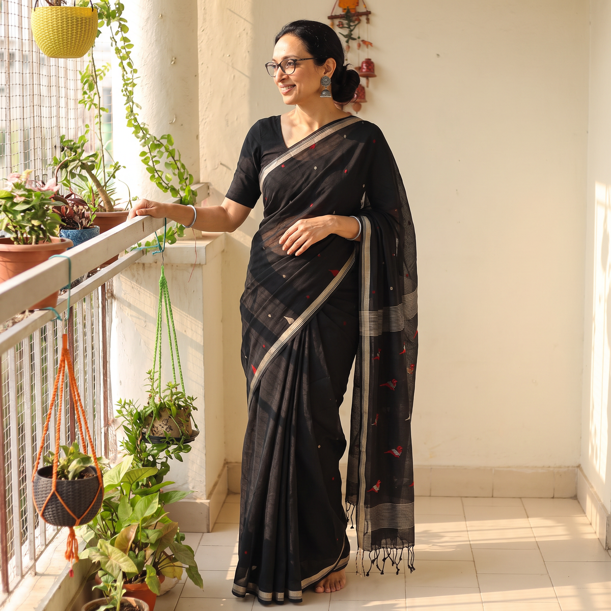 Black Handloom Cotton Phulia Jamdani Saree with Tassels, draped and worn by a woman, AI visual of the saree, iTokri