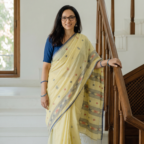 Yellow Handloom Cotton Phulia Jamdani Saree with Tassels, draped and worn by a woman, AI visual of the saree, iTokri