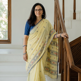 Yellow Handloom Cotton Phulia Jamdani Saree with Tassels, draped and worn by a woman, AI visual of the saree, iTokri