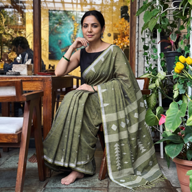 Green Handloom Cotton Phulia Jamdani Saree with Tassels, draped and worn by a woman, AI visual of the saree, iTokri
