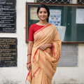 Brown Handloom Cotton Phulia Jamdani Saree with Tassels, draped and worn by a woman, AI visual of the saree, iTokri