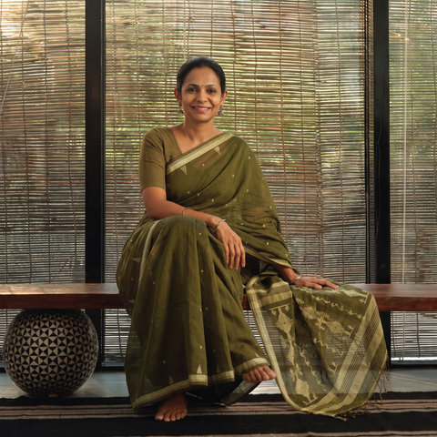 Green Handloom Cotton Phulia Jamdani Saree with Tassels, draped and worn by a woman, AI visual of the saree, iTokri