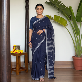 Blue Handloom Cotton Phulia Jamdani Saree with Tassels, draped and worn by a woman, AI visual of the saree, iTokri