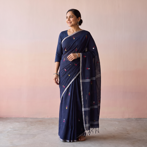 Blue Handloom Cotton Phulia Jamdani Saree with Tassels, draped and worn by a woman, AI visual of the saree, iTokri