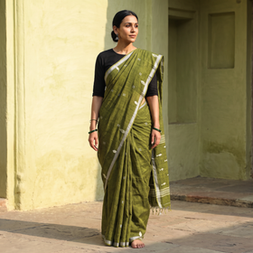 Green Handloom Cotton Phulia Jamdani Saree with Tassels, draped and worn by a woman, AI visual of the saree, iTokri
