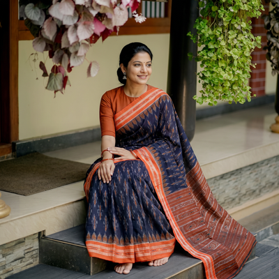 Blue Handloom Cotton Sambalpuri Ikat Saree, draped and worn by a woman, AI visual of the saree, iTokri