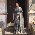 Black Handloom Cotton Sambalpuri Ikat Saree, draped and worn by a woman, AI visual of the saree, iTokri