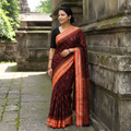 Maroon Handloom Cotton Sambalpuri Ikat Saree, draped and worn by a woman, AI visual of the saree, iTokri