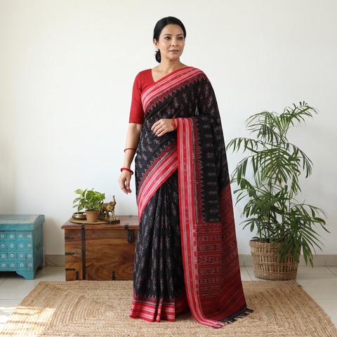 Black Handloom Cotton Sambalpuri Ikat Saree, draped and worn by a woman, AI visual of the saree, iTokri
