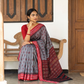 Grey Handloom Cotton Sambalpuri Ikat Saree, draped and worn by a woman, AI visual of the saree, iTokri