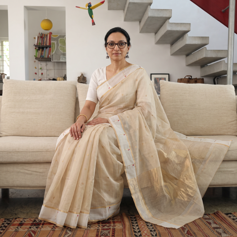 Beige Handloom Cotton Tissue Zari Buti Chanderi Saree, draped and worn by a woman, AI visual of the saree, iTokri