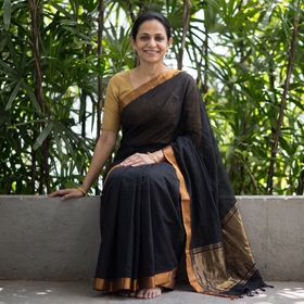 Black Handloom Cotton Zari Border Mangalagiri Saree, draped and worn by a woman, AI visual of the saree, iTokri