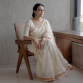 White Handloom Cotton Zari Buti Phulia Jamdani Saree, draped and worn by a woman, AI visual of the saree, iTokri