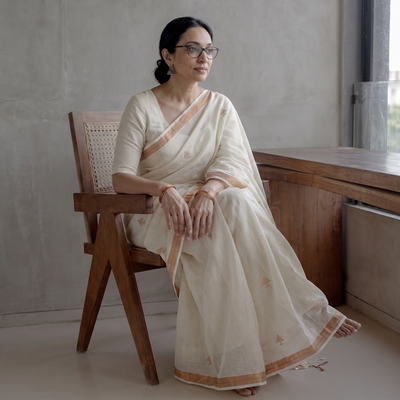 White Handloom Cotton Zari Buti Phulia Jamdani Saree, draped and worn by a woman, AI visual of the saree, iTokri