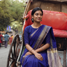 Blue Handloom Kosa Pallu Maheshwari Silk Saree, draped and worn by a woman, AI visual of the saree, iTokri