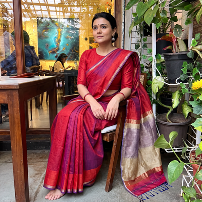 Orange Handloom Kosa Pallu Maheshwari Silk Saree, draped and worn by a woman, AI visual of the saree, iTokri