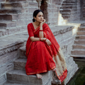 Red Handloom Kosa Pallu Maheshwari Silk Saree, draped and worn by a woman, AI visual of the saree, iTokri