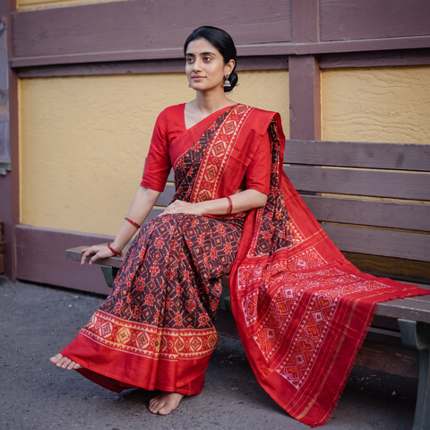 Maroon Handloom Mulberry Silk Patola Ikat Pochampally Saree, draped and worn by a woman, AI visual of the saree, iTokri