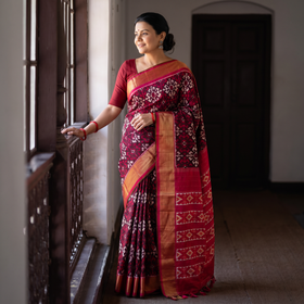 Maroon Handloom Mulberry Silk Patola Ikat Pochampally Saree, draped and worn by a woman, AI visual of the saree, iTokri