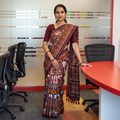 Maroon Handloom Mulberry Silk Patola Ikat Pochampally Saree, draped and worn by a woman, AI visual of the saree, iTokri