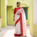 White Handloom Pure Cotton Phulia Jamdani Saree, draped and worn by a woman, AI visual of the saree, iTokri