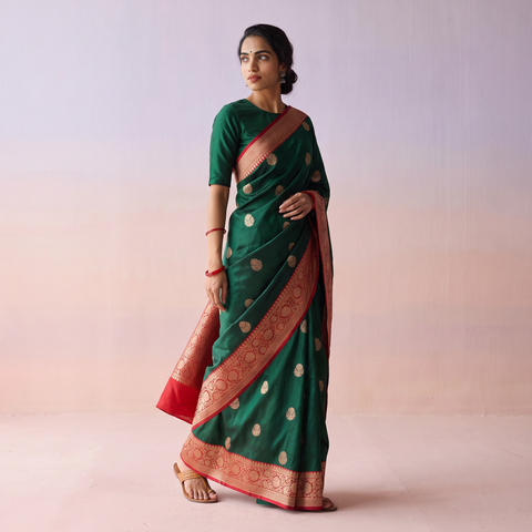 Green Handloom Pure Katan Silk Kaduwa Zari Buti Banarasi Saree, draped and worn by a woman, AI visual of the saree, iTokri