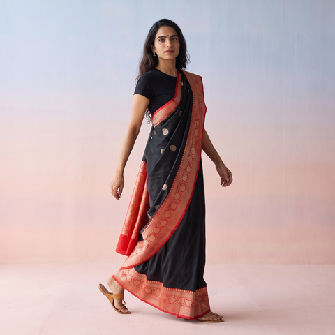 Black Handloom Pure Katan Silk Kaduwa Zari Buti Banarasi Saree, draped and worn by a woman, AI visual of the saree, iTokri