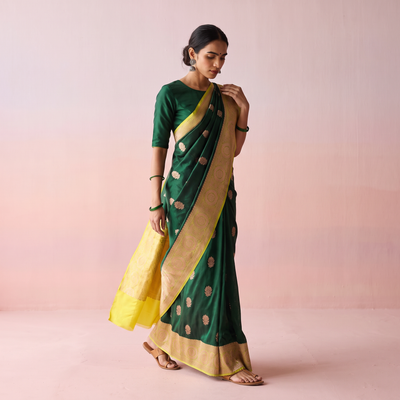 Green Handloom Pure Katan Silk Kaduwa Zari Buti Banarasi Saree, draped and worn by a woman, AI visual of the saree, iTokri