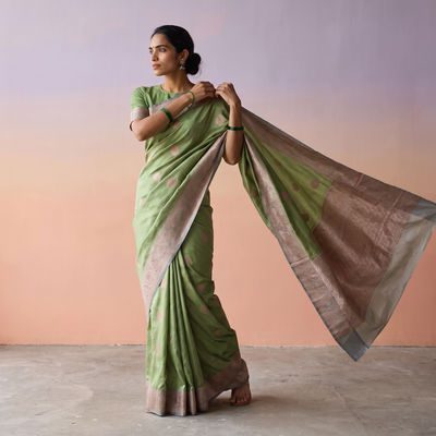 Green Handloom Pure Katan Silk Kaduwa Zari Buti Banarasi Saree, draped and worn by a woman, AI visual of the saree, iTokri