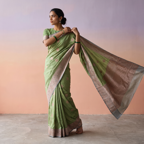 Green Handloom Pure Katan Silk Kaduwa Zari Buti Banarasi Saree, draped and worn by a woman, AI visual of the saree, iTokri