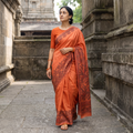 Orange Handloom Silk Cotton Handpainted Madhubani Saree, draped and worn by a woman, AI visual of the saree, iTokri