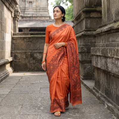 Orange Handloom Silk Cotton Handpainted Madhubani Saree, draped and worn by a woman, AI visual of the saree, iTokri